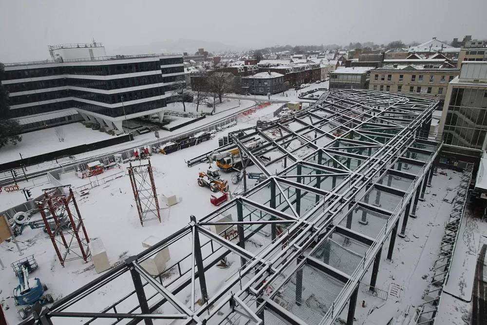 Image showing halt in construction due to snowfall during steel erection of Gloucester's new bus station
