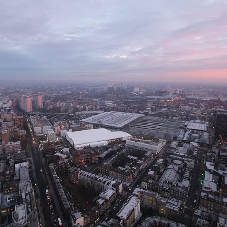 Sunrise over Euston Station and the surrounding Central London area, overlooking the ongoing HS2 works on multiple construction sites