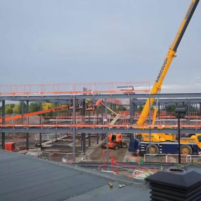 Time-lapse image of a Kier construction project, overlooking a crane and the erection of steelwork at Thorndown Primary School.