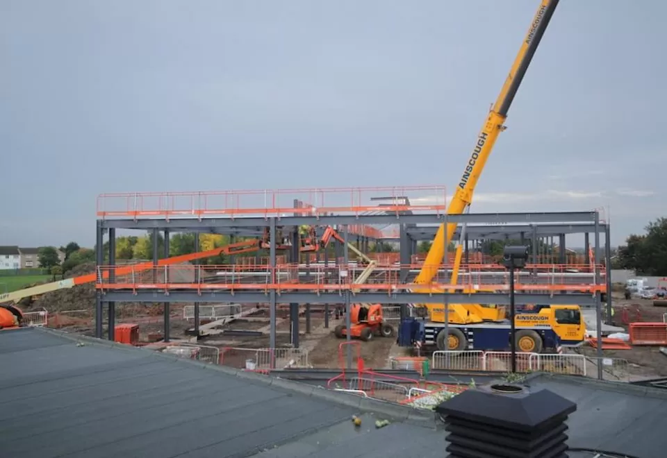 Time-lapse image of a Kier construction project, overlooking a crane and the erection of steelwork at Thorndown Primary School.