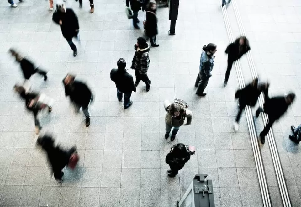 Aerial view of pedestrians, featuring motion blur.