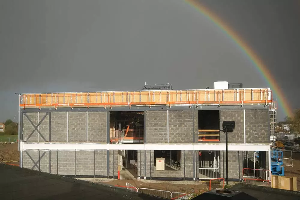 Rainbow over construction for an educational build in Saint Ives.