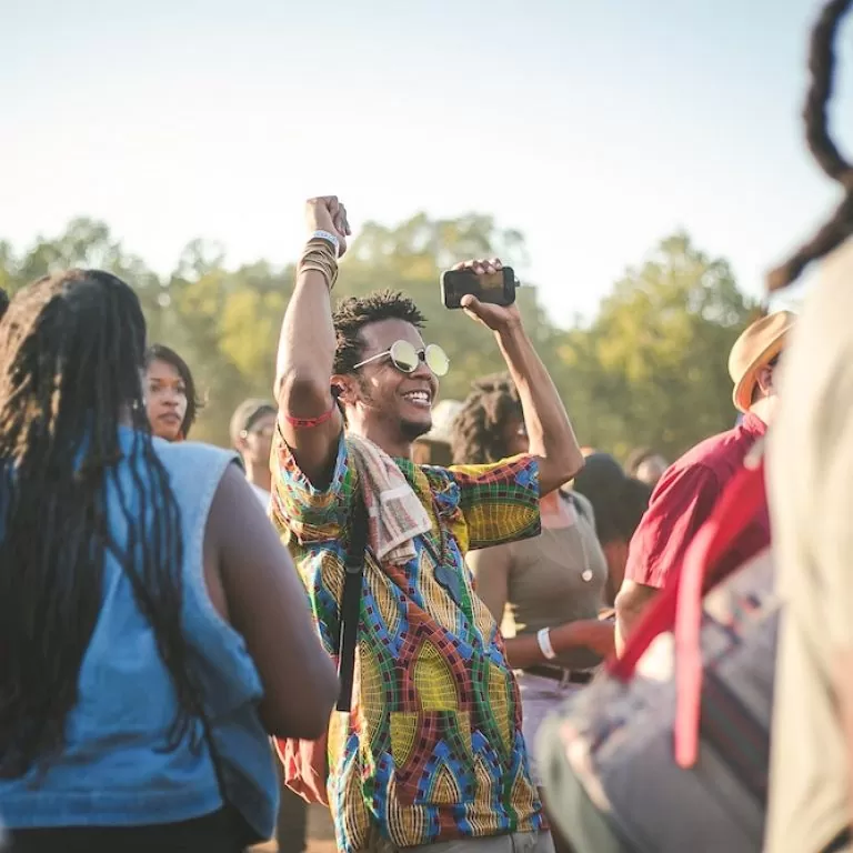 Crowds gathering in the sunshine at the afropunk festival.