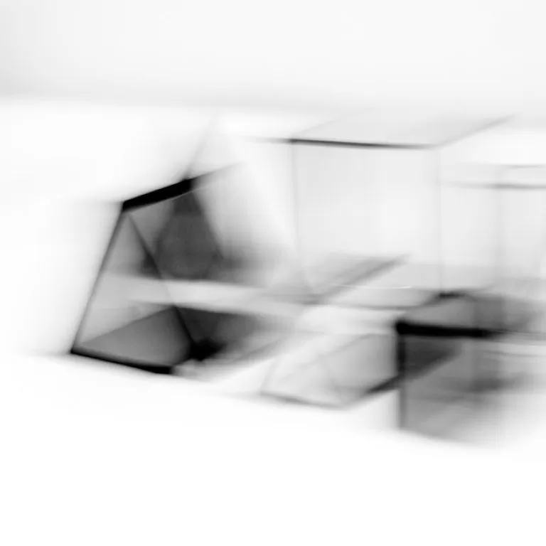 Blurred black and white composition of minimal shapes.