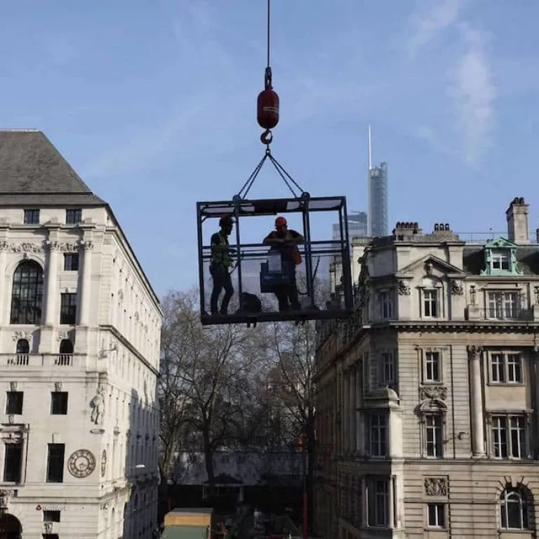 Using a crane and cage over the Moorgate Station project to access the camera system