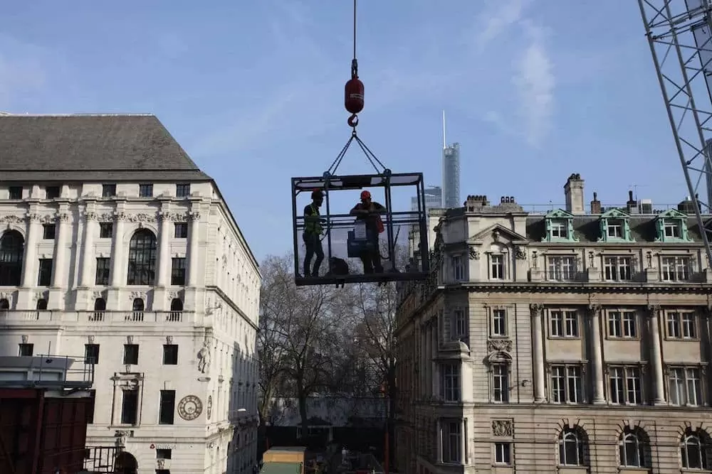 Using a crane and cage over the Moorgate Station project to access the camera system