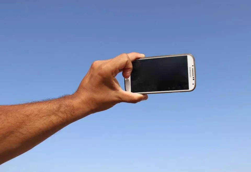 A smartphone in position to take a selfie.
