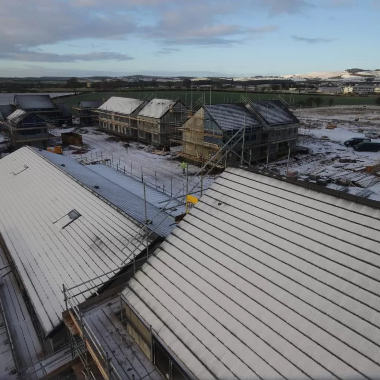Snow begins to melt at a housing development in Duns
