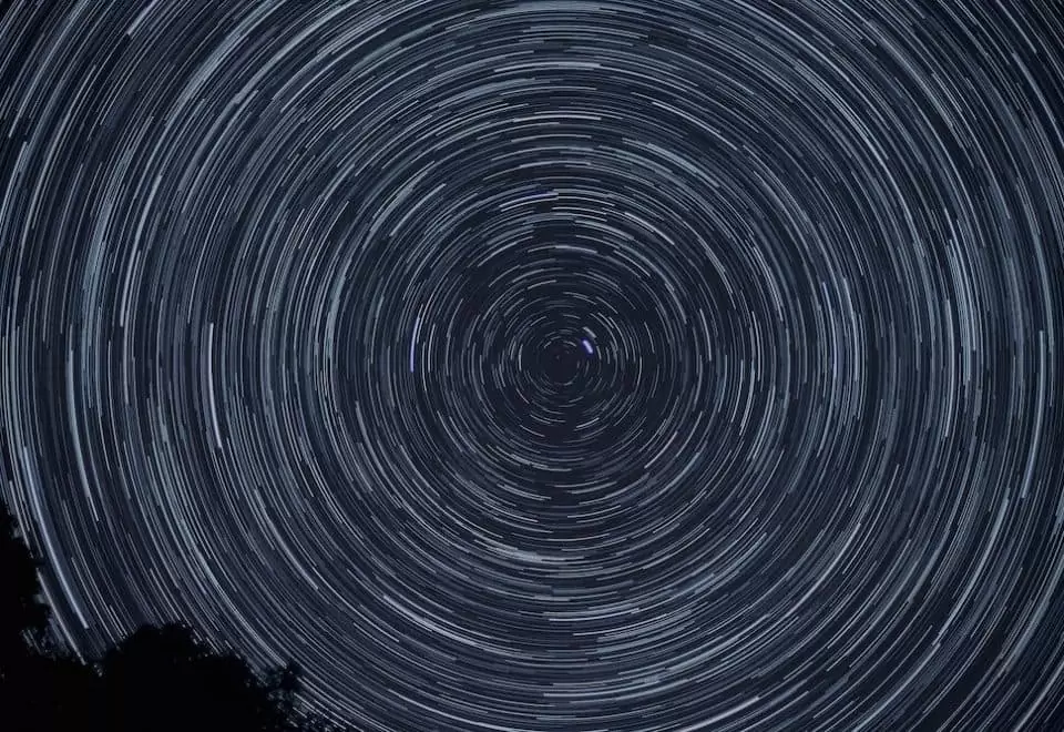 Circular celestial patterns as part of a night sky.