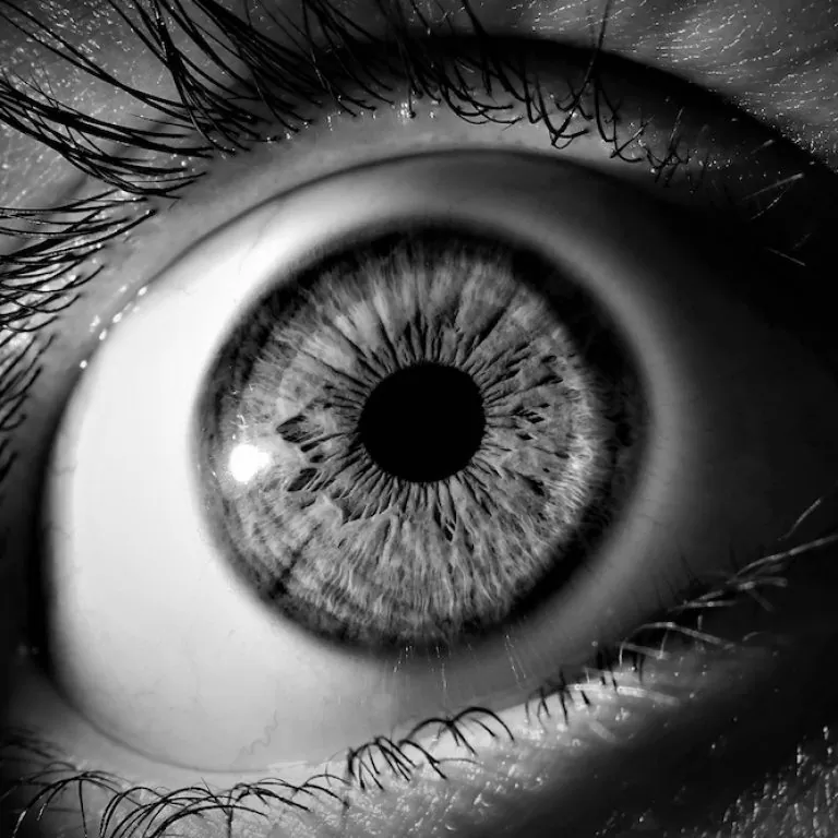 Black and white eye looking at time-lapse video
