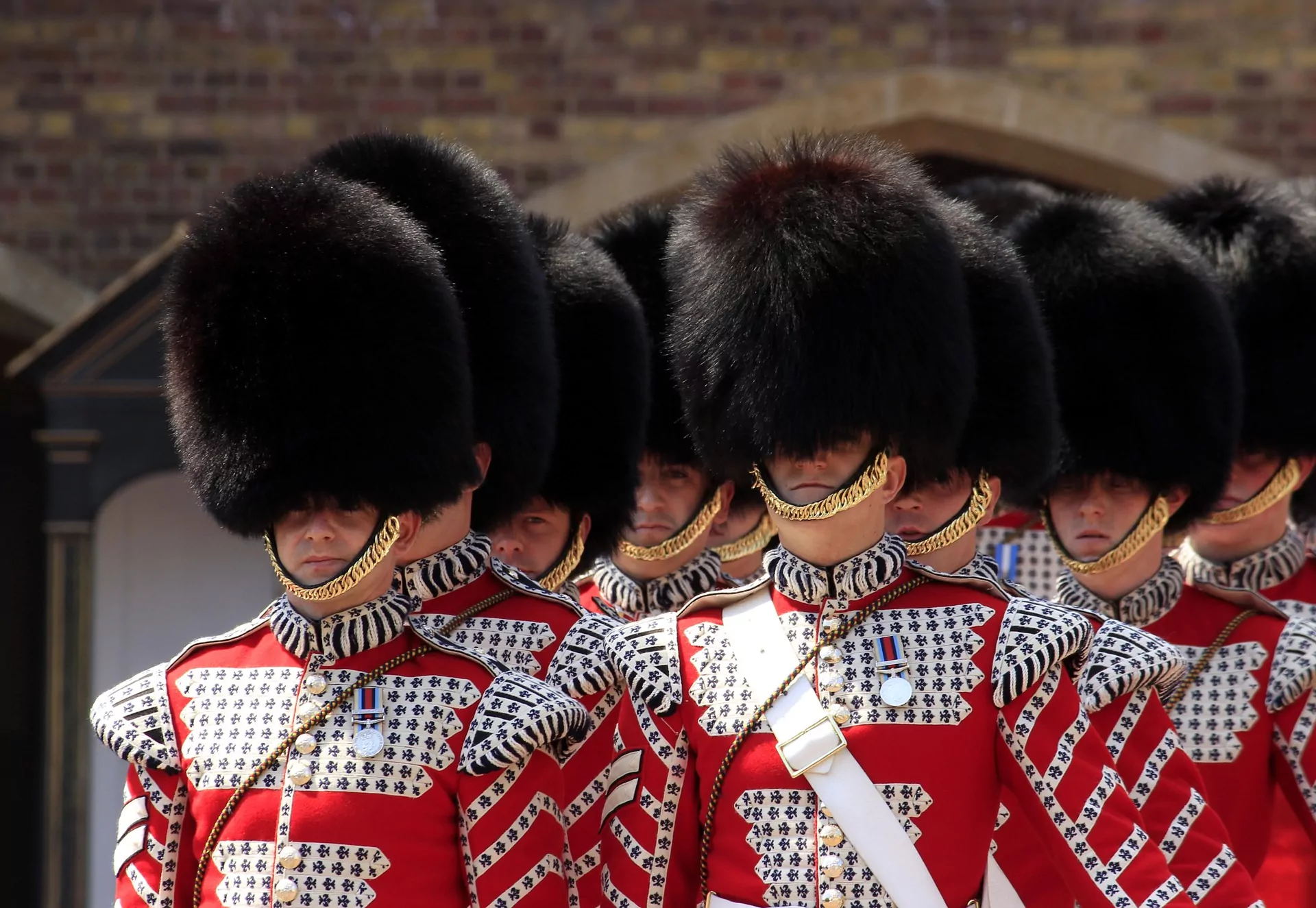 Royal Guards march at Buckingham Palace, London. Our article discusses time-lapse footage of nationwide celebrations of King Charles III's coronation.