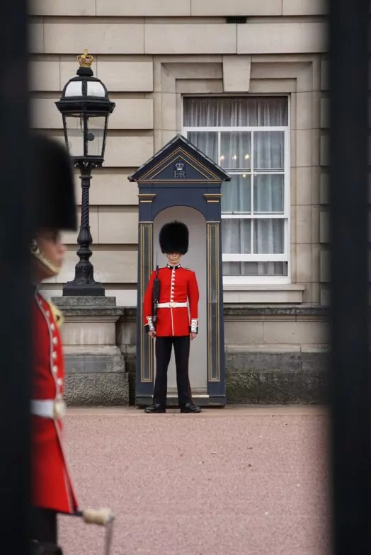 Guards on duty at Buckingham Palace. Our article looks at time-lapse footage of celebrations of King Charles III's coronation.