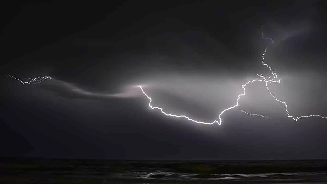 A thunderbolt in a jet black sky.