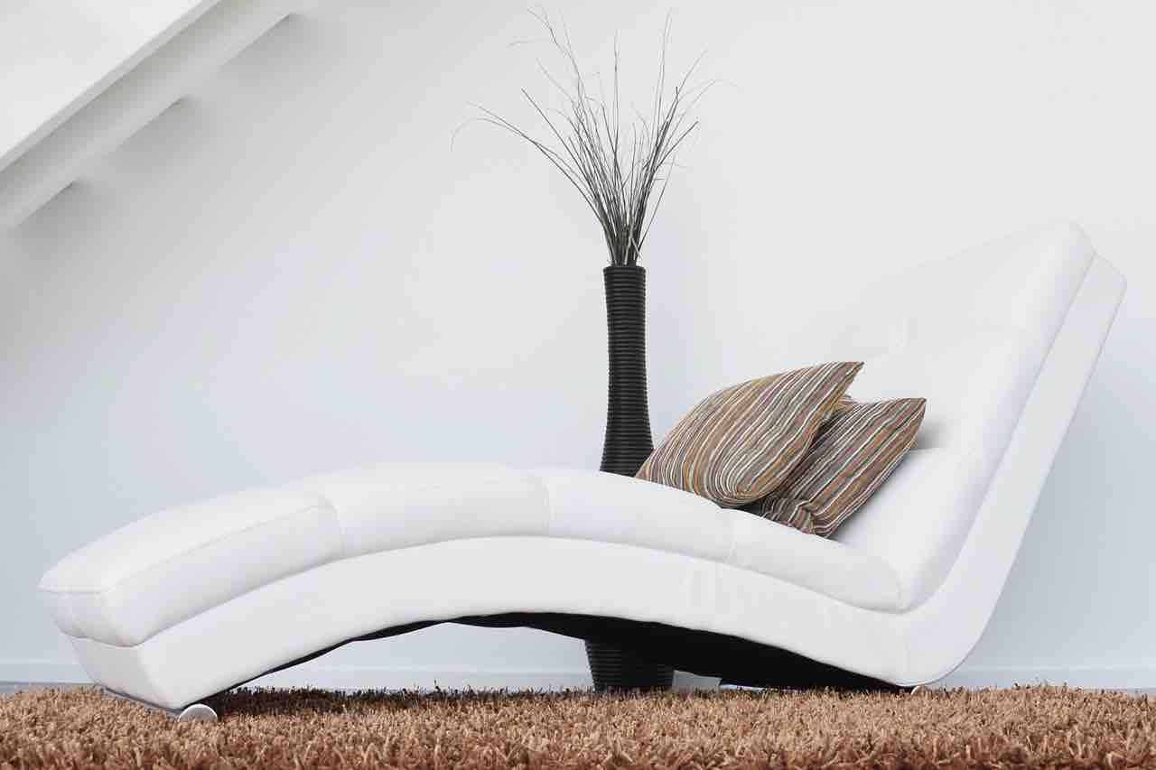An image of a modern white curved chair.